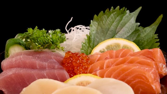 Close-Up Rotating Japanese Sashimi Sushi Platter on Black