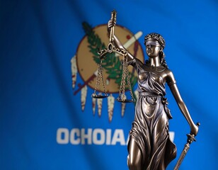 Fototapeta premium Lady Justice statue before a state flag