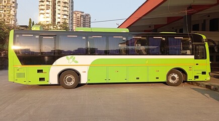 Electric bus for sustainable transport, showcasing a modern eco-friendly vehicle waiting at a terminal. This zero-emission, soundless electric bus highlights the future of mobility and clean energy. © amol