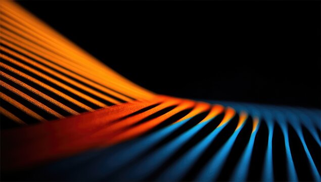 Abstract design of vibrant orange and blue lines.  Curved, parallel lines creating a dynamic, three-dimensional effect against a black background.  Strong colors and depth of field