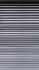 Obraz premium Horizontal grey lines, subtly fading at top and bottom, create a texture reminiscent of a shutter or blind