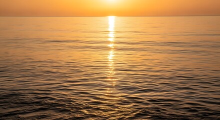 Golden Sunrise Reflections on Gentle Ocean Waves