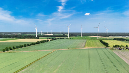 Aerial drone view of windmill energy farm, industrial area landscape with turbine green energy production, wind turbines generating electricity, the Netherlands