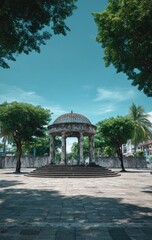 A gazebo in a sunny plaza, surrounded by trees