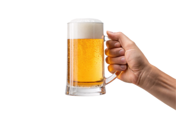 Hand holding clear glass beer mug containing golden amber brew with thick white foam top, isolated on a transparent background