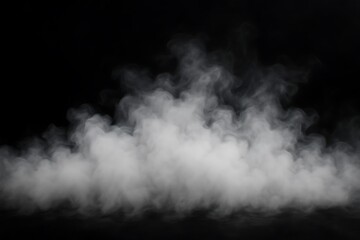Fototapeta premium Wisps of white smoke rising against a stark black background