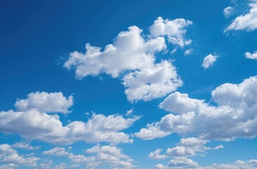 Fototapeta premium A vibrant blue sky dotted with puffy white clouds