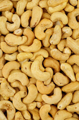 Raw shelled South American cashew nut detail texture background