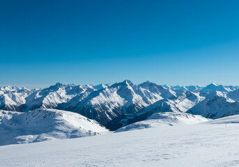 Winter's Embrace Snow-Capped Mountains Under Azure Skies, a landscape  in the snow