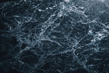 Dark, veined marble surface