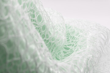 Light green translucent lace with intricate patterns and soft folds, evoking romance and elegance;...
