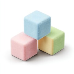 Three pastel-colored cube candies stacked