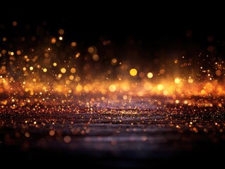 Golden glitter bokeh on dark background