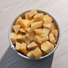 Juicy peach cut into perfect cubes, showcasing its vibrant orange color and sweet, refreshing flavor. Ideal for fruit salads, desserts, smoothies, or a healthy snack!