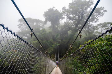 A misty suspension bridge in Costa Rica
