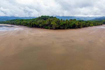 Girl walking on a beach in Uvita Costa Rica