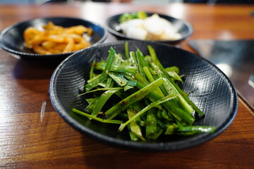Korean Side Dishes with Fresh Garlic Chives and Assorted Banchan