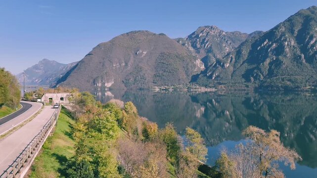 Drone shot over the village of Rocca d'Anfo at Lake Idro in Lombardy, Italy