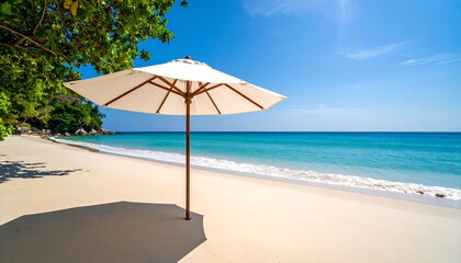 Fototapeta premium Serene beach scene with white umbrella, turquoise water, and soft sand