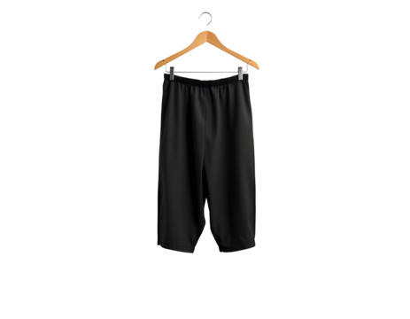 Black cropped pants hanging on a wooden hanger