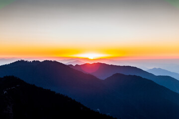 Sunrise Over Rolling Hills