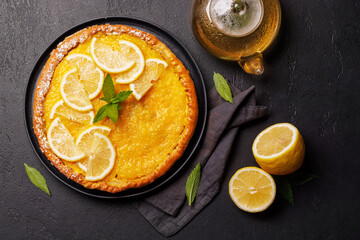 Delicious lemon tart with golden crust and smooth, glossy lemon filling