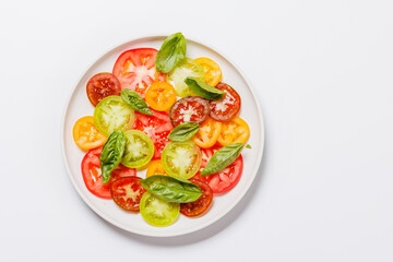 Colorful sliced tomatoes on a plate, fresh and vibrant