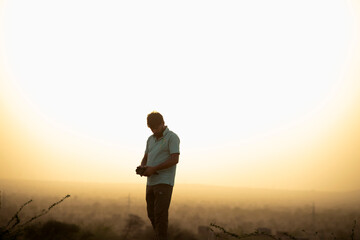 A photographer capturing photos with high sunlight in background