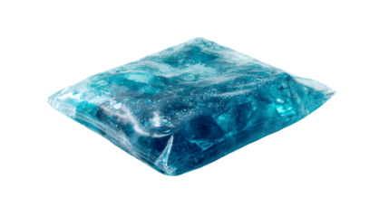 A clear plastic bag filled with blue colored candy pieces on a black isolated background studio shot