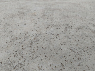 the very first drops of rain on the concrete roof or terrace. the beginning of a summer shower