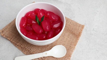 Manisan Kolang-Kaling, or preserved sugar palm fruit with red pink color, Indonesian drink and dessert during the month of Ramadan