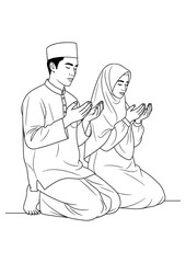 A young Muslim couple, a man and a woman, are kneeling together and praying.