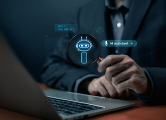 Businessman analyzing AI assistant chatbot icon through on laptop, symbolizing artificial intelligence, customer support automation, innovative virtual communication technology solutions. AI smart