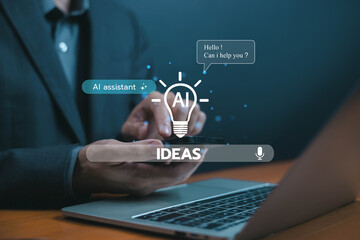 Businessman using AI assistant on smartphone and laptop, generating creative ideas through voice command, representing artificial intelligence, innovation, smart technology solutions for productivity.