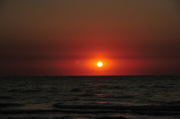 Beautiful crimson sunset over the sea.