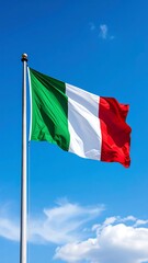 Italian flag billowing in a clear blue sky