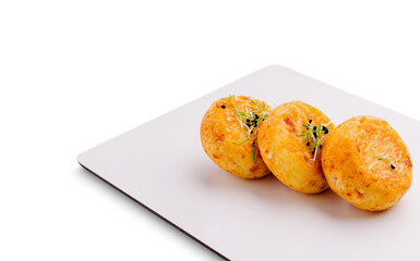 Savory cheese balls with herbs served on a modern plate