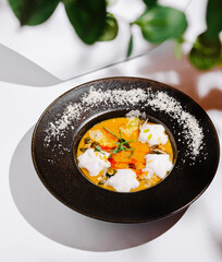 Colorful gourmet dish featuring vibrant ingredients on a sleek plate