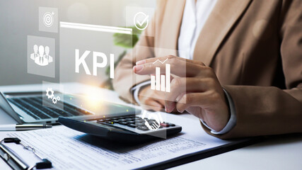 Key Performance Indicators KPI Dashboard, Businesswoman using laptop dashboard graph data analysis KPI, Database connection metrics to track operational data, revenue and sales performance.