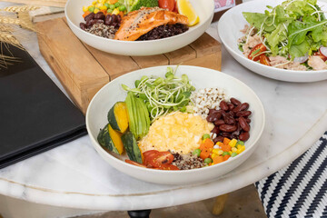 Vegetarian breakfast bowl with scrambled eggs and grains
