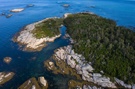 Aerial view of rocky islands in Canso Nova scotia set on blue water