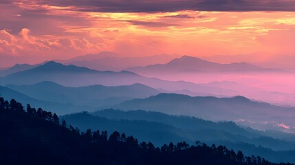Obraz premium Layered mountain range at sunrise.