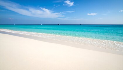 Obraz premium Pristine white sand beach meets tranquil turquoise water under a vibrant blue sky