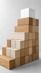 Stack of wooden blocks arranged in a staircase pattern against a light background