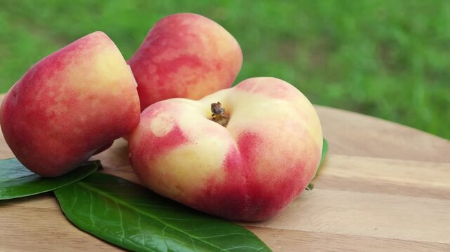 Fresh peaches on a wooden background. Flat peach donut shape