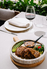 Delicious grilled steak with vegetables served in an elegant dining setting