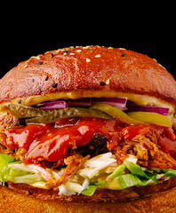 Delicious pulled chicken burger with fresh toppings and rich sauces
