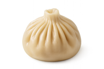 Single Steamed Soup Dumpling on Black Background