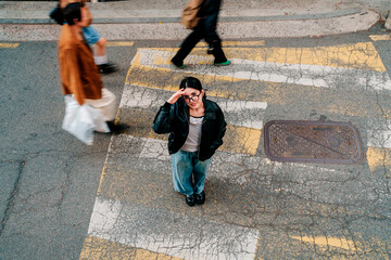 Urban fashion lifestyle on Seoul street with woman in leather jacket