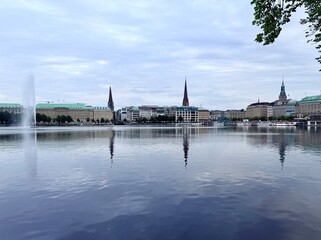 old city centre building reflections on the lake surface, lake in the historical city centre